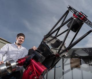 Astrophysicist Billy Quarles at the telescope atop Georgia Tech's observatory