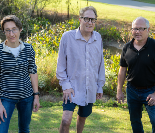 Researchers by campus wetlands