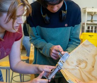 The team working in the College of Design’s woodworking space during the squirrel box-building event. Photo credit: Thomas Bordeaux, ARCH 2022. 